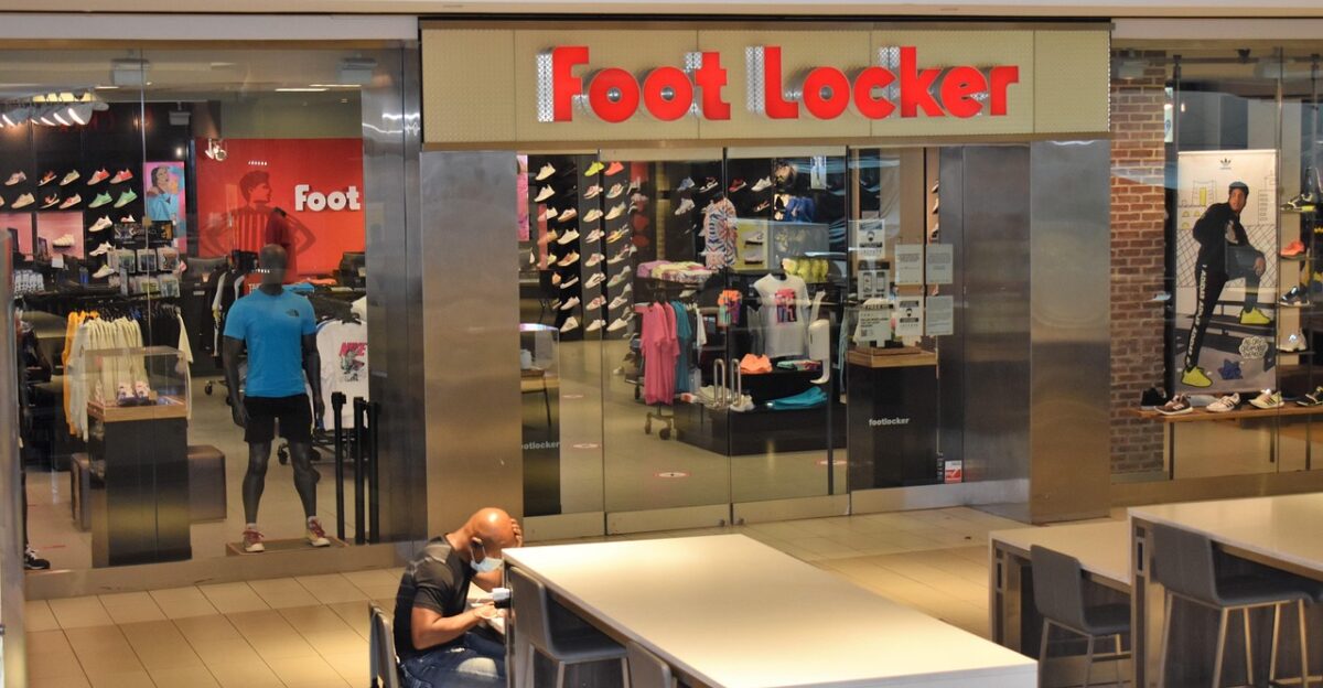 mall store shop footlocker shoe store sneakers t-shirts sports apparel sporting goods empty vacant one man covid-19 effect galleria mall houston texas usa retail photography photograher of retail stores