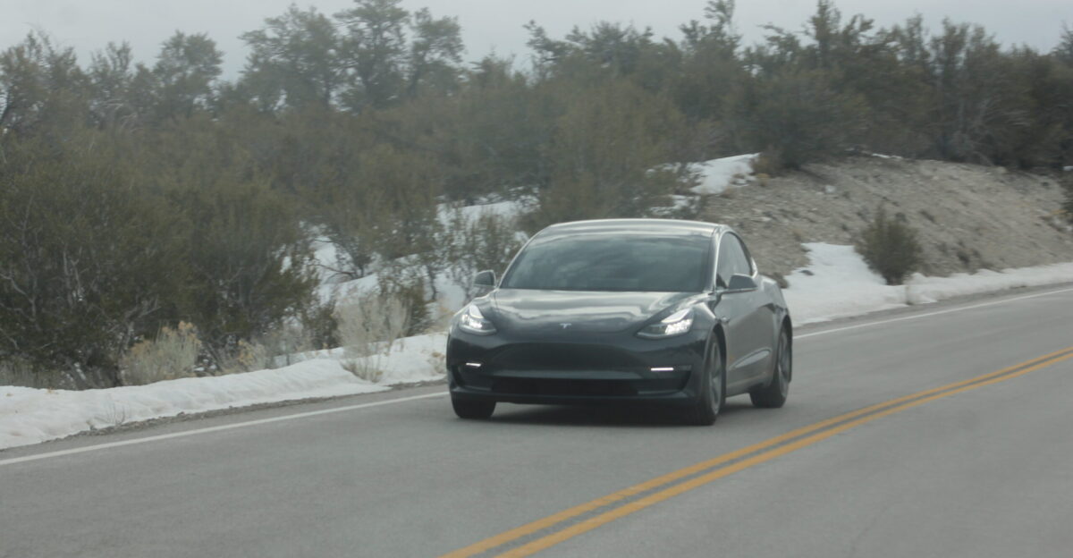 A grey Tesla Model 3 driving on Mount Charleston in Nevada