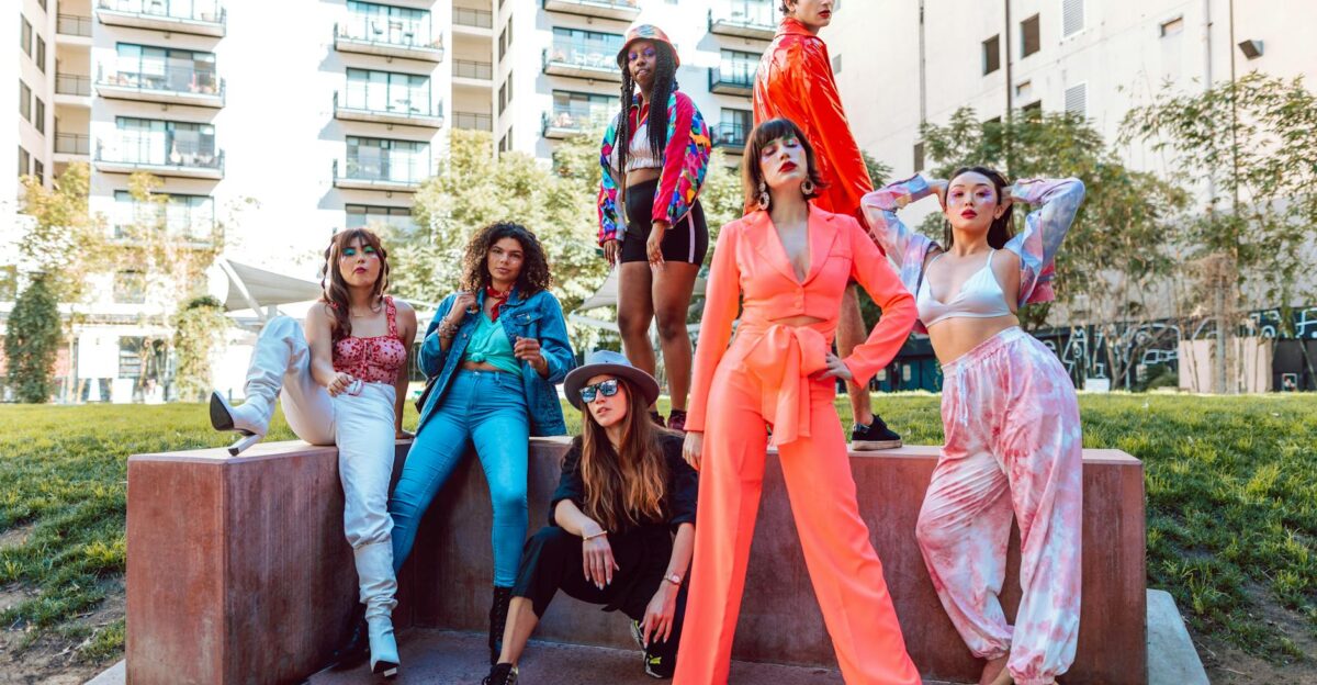 A fashion-forward diverse group showcasing vibrant street style in a city backdrop