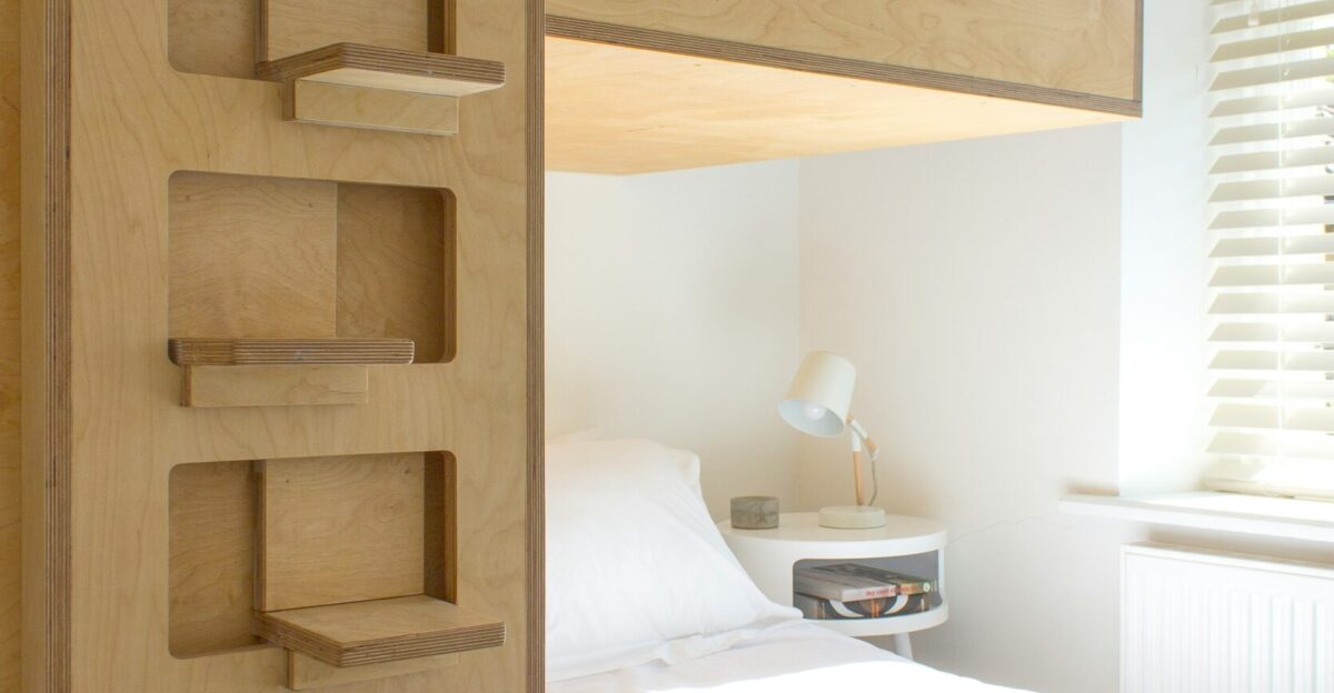 white bed linen near brown wooden bed frame