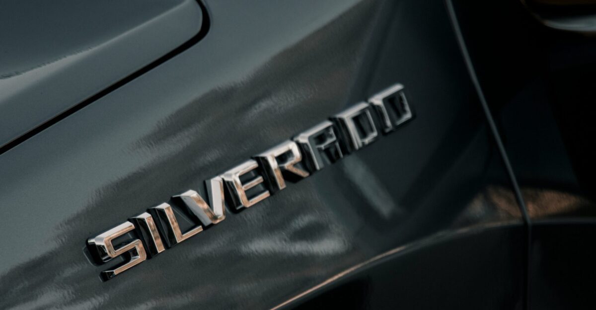 a close up of a silver car s emblem