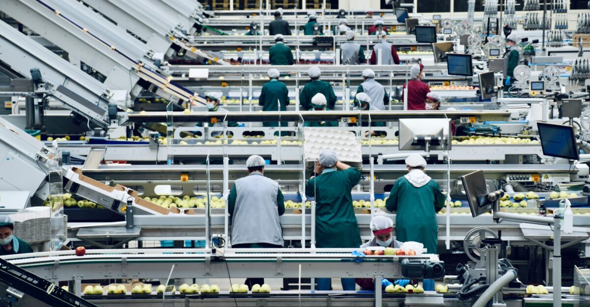 a group of people in a factory