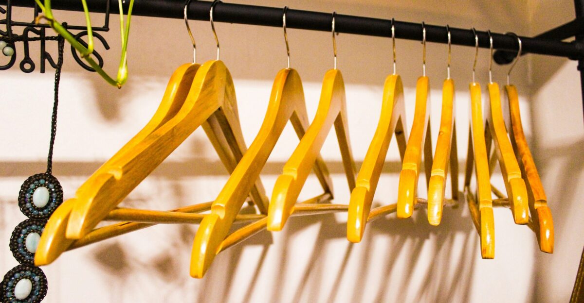 a rack of clothes hanging on a wall