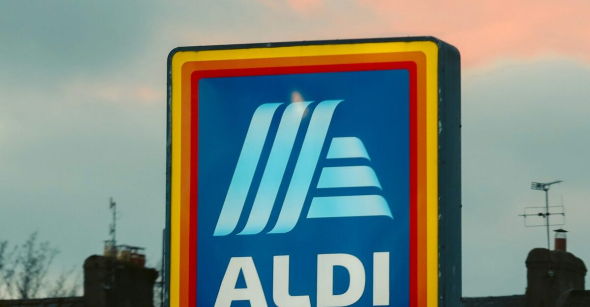 a blue and yellow aldi sign in front of a building