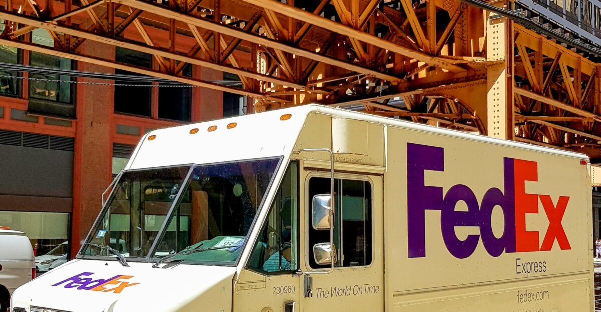 A fedex truck parked on the side of the road