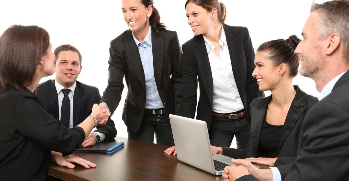 people business meeting business meeting coworkers agreement men women professionals office employees suit work greeting boss computer group handshake desk team colleagues arrangement people business business business business business meeting meeting business meeting office office work team