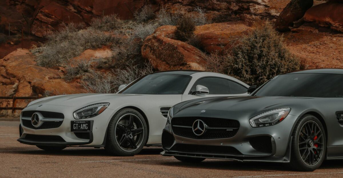 Two Mercedes-AMG GT sports cars at Red Rocks Colorado showcasing sleek design in a stunning outdoor setting
