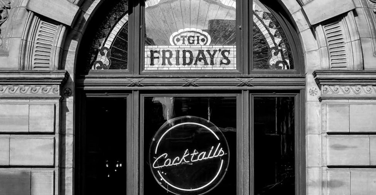 Black and white photo of TGI Fridays storefront in Glasgow featuring street architecture