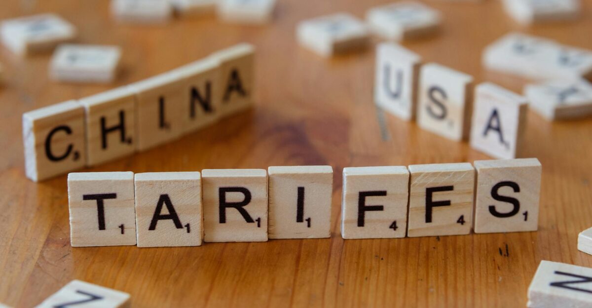 Wooden letter blocks spelling tariffs China and USA representing trade relations