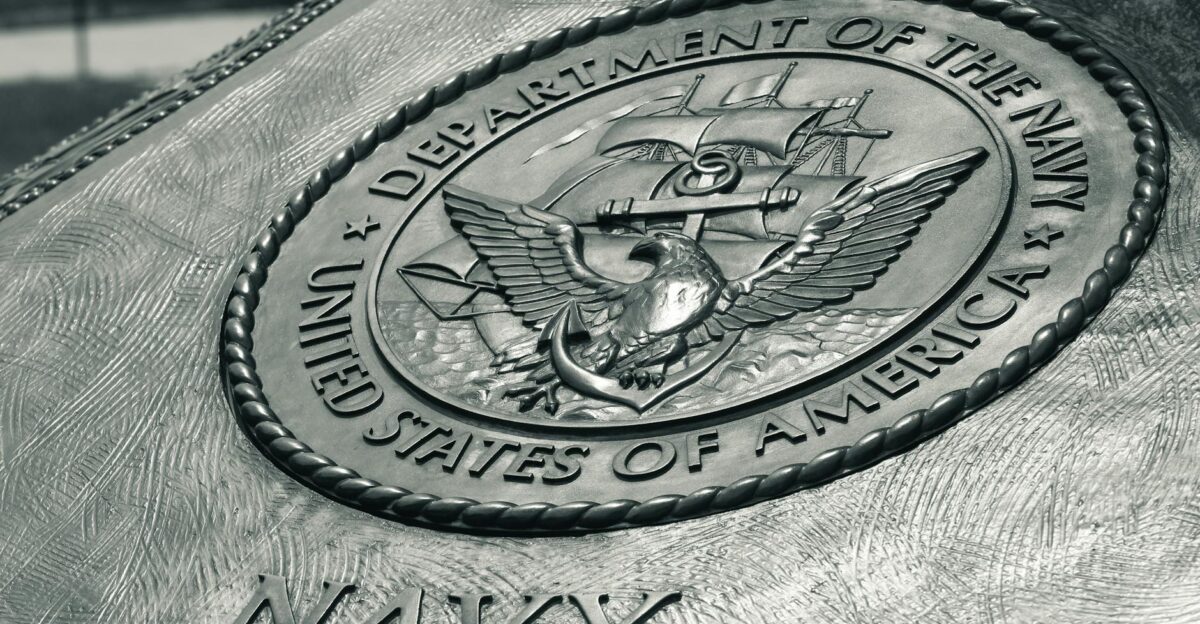 Detailed view of the United States Navy emblem on a monument in Washington D C showcasing naval heritage
