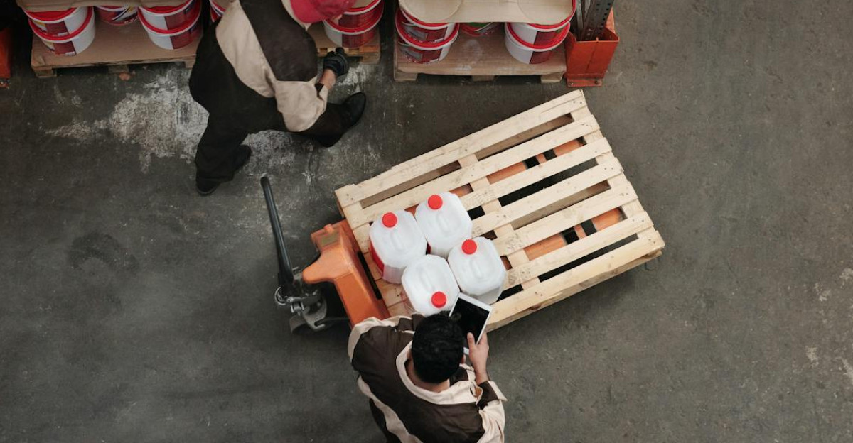 High angle view of workers organizing inventory in a warehouse