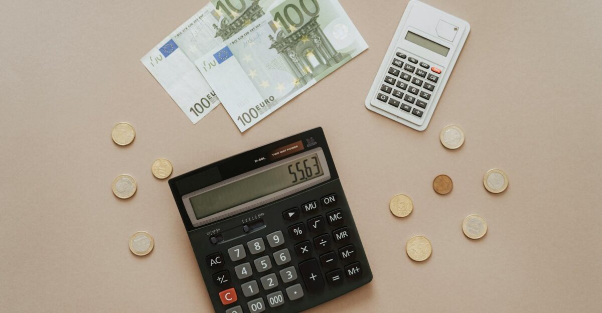Flat lay of calculators and Euro currency depicting financial calculations and budget management