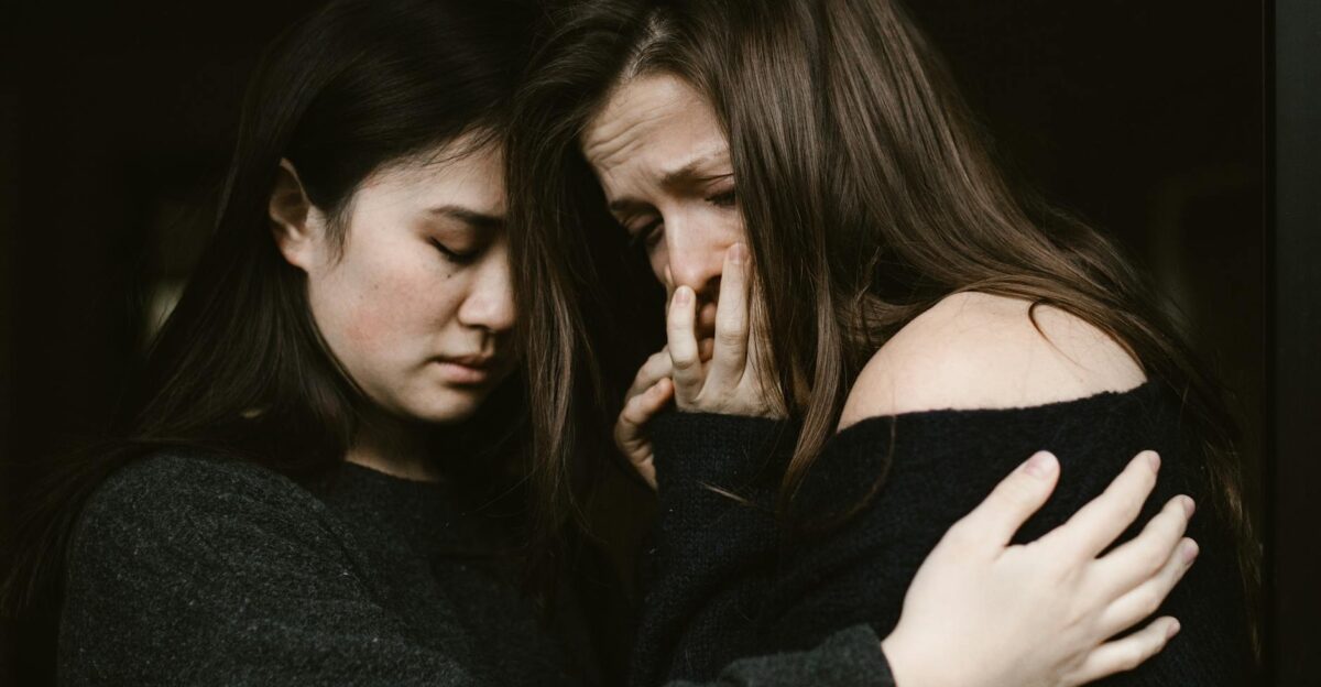 A close-up of two women sharing a heartfelt moment highlighting empathy and comfort during tough times