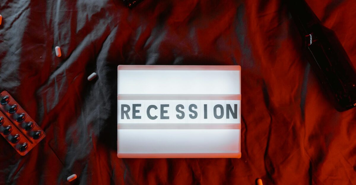Conceptual image of recession with pills and beer bottles symbolizing stress and crisis