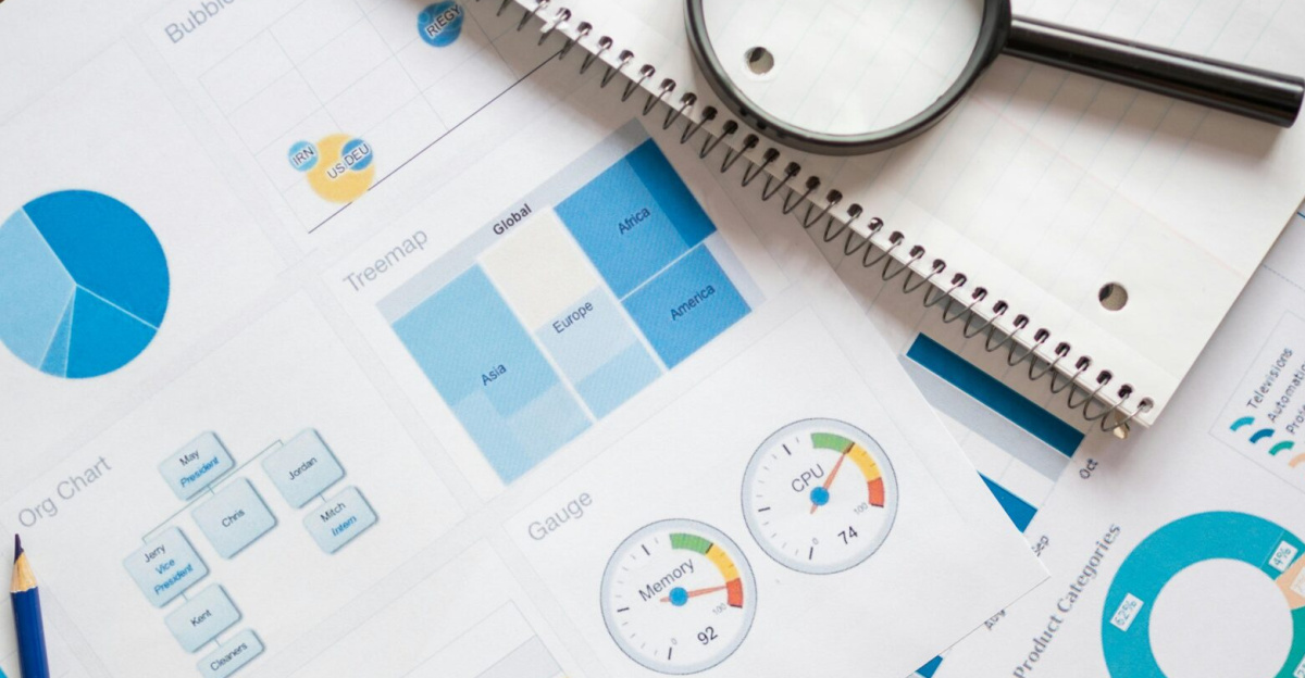 A set of financial charts and graphs with a magnifying glass, perfect for business reports.