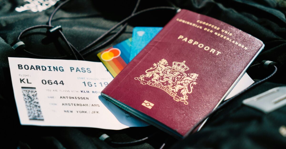 a passport and a boarding pass are on a bag