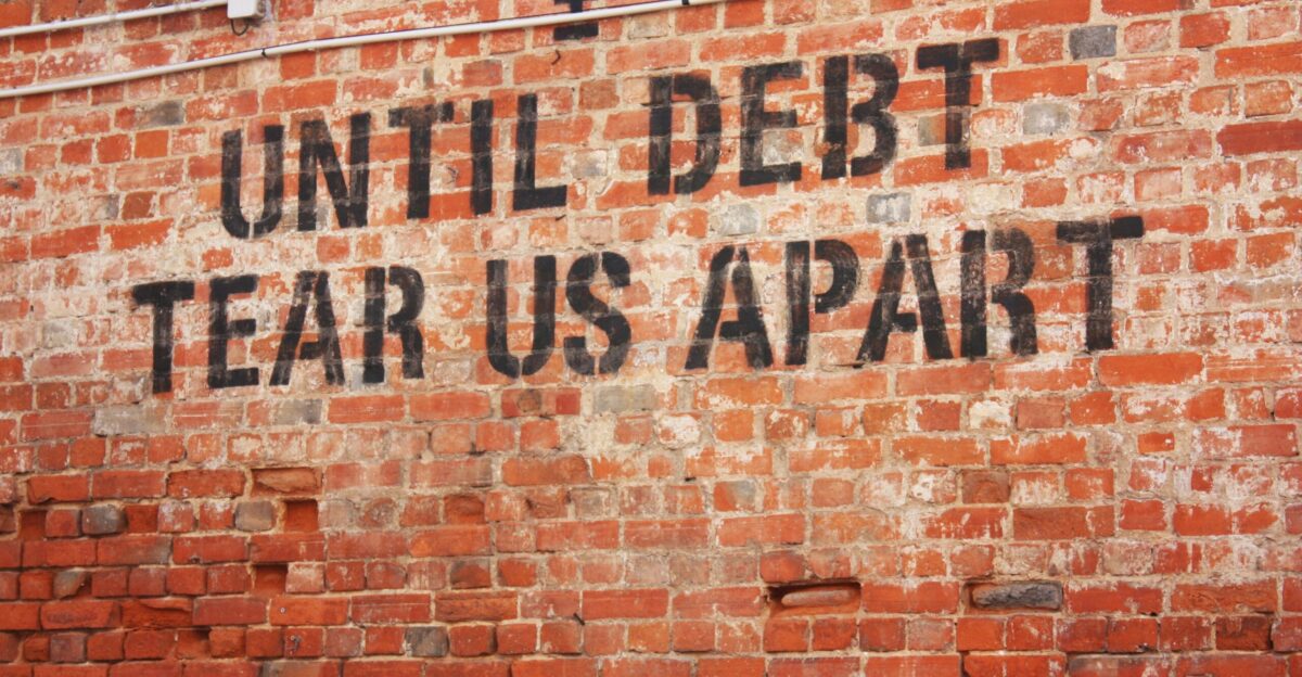 a brick wall with a message written on it