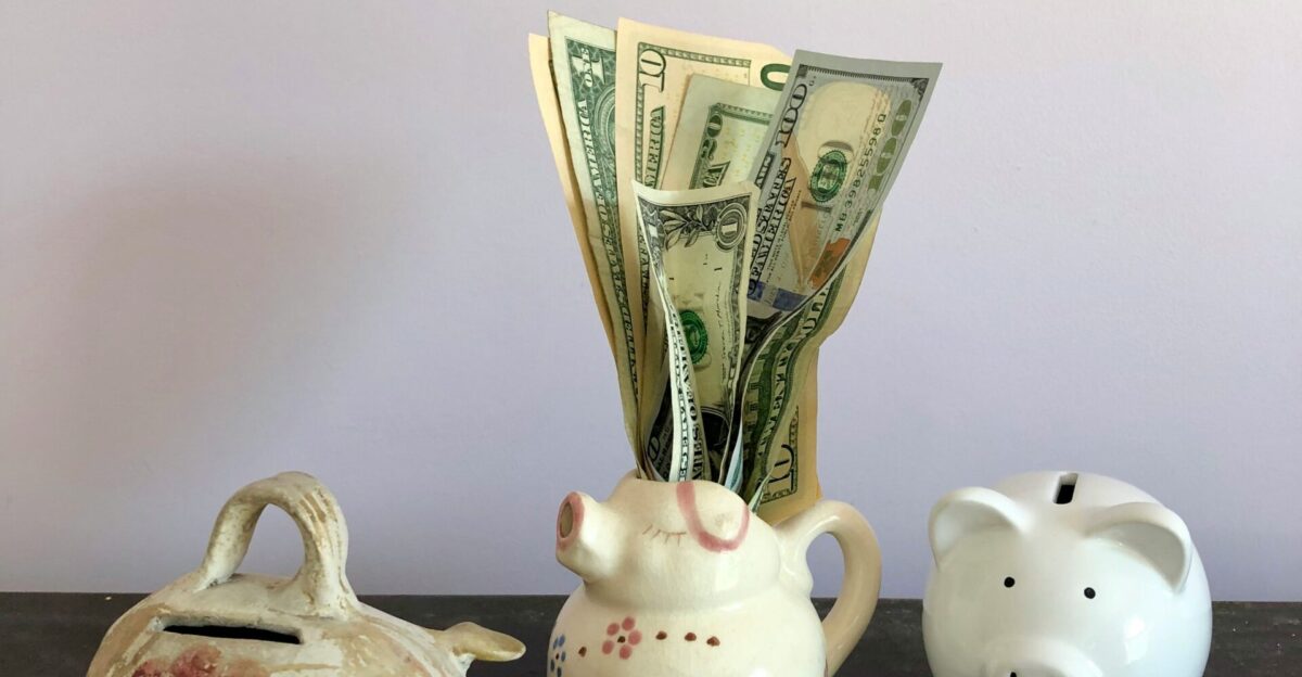white ceramic teapot beside white ceramic teapot