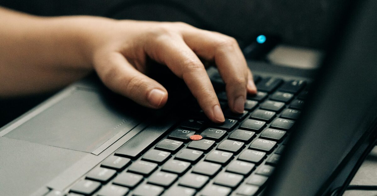 person using black and gray laptop computer