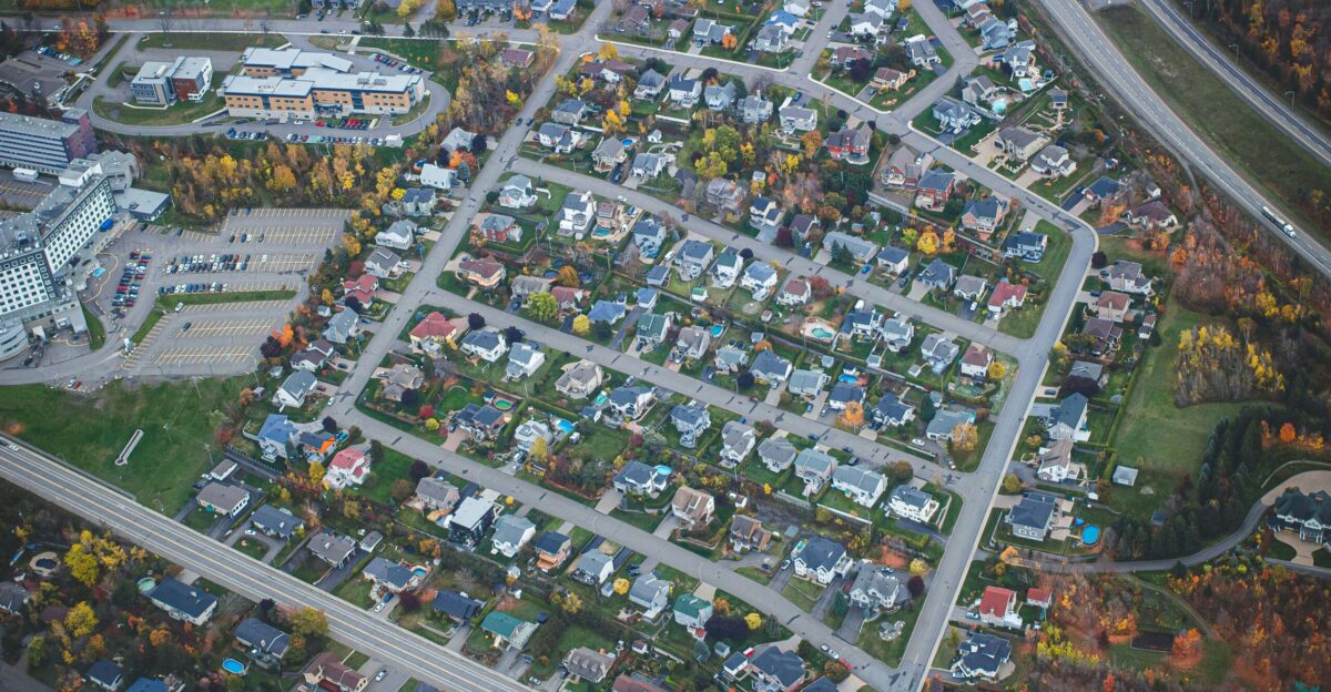 an aerial view of a city with lots of houses