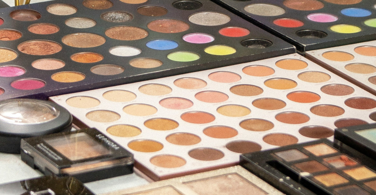 a table topped with lots of makeup and brushes