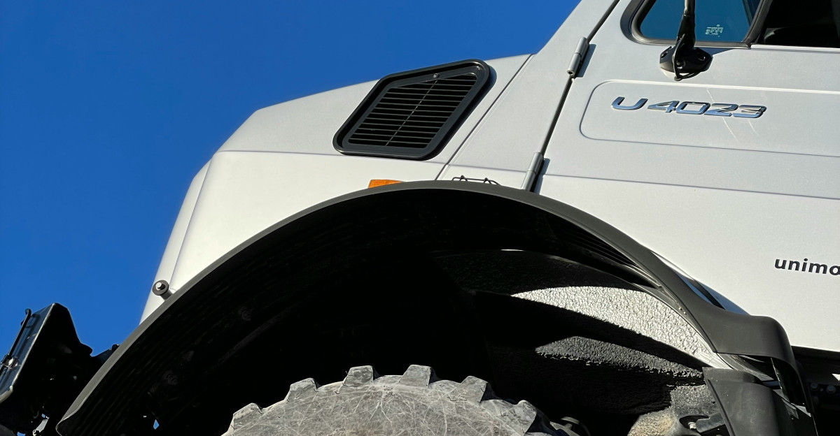 a white truck with a flat tire