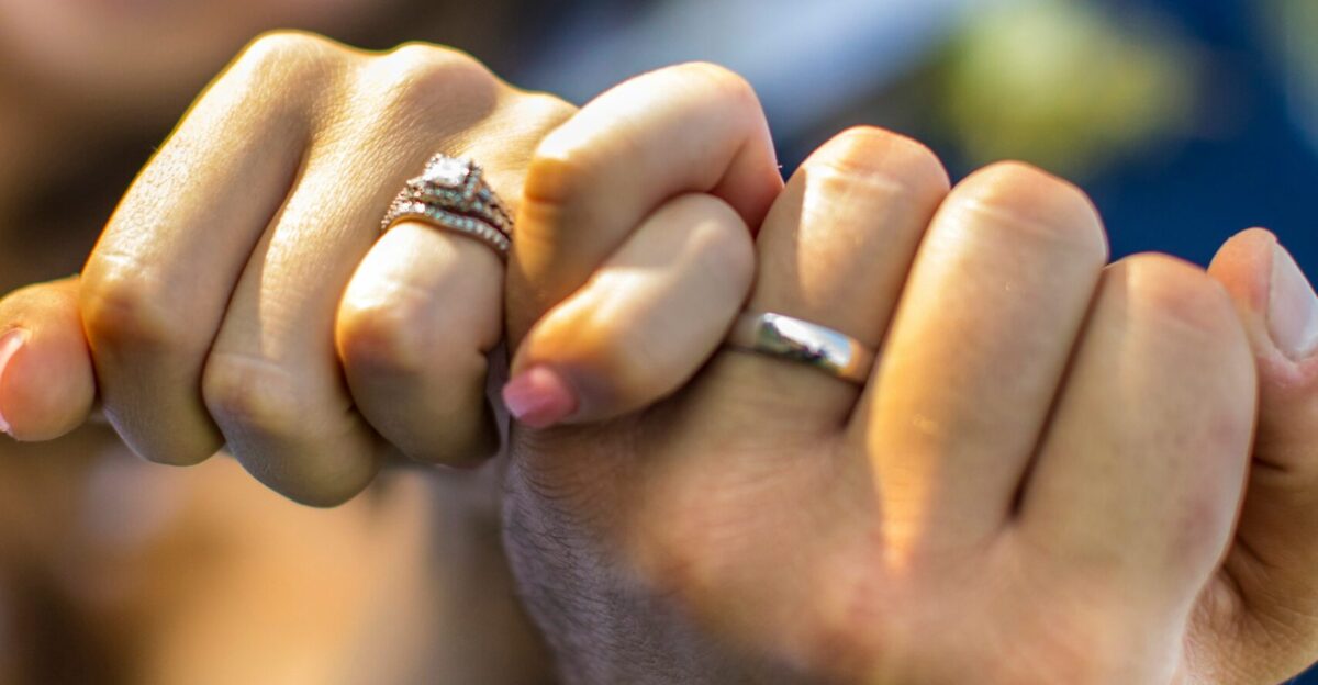 a close-up of a person holding the hands together