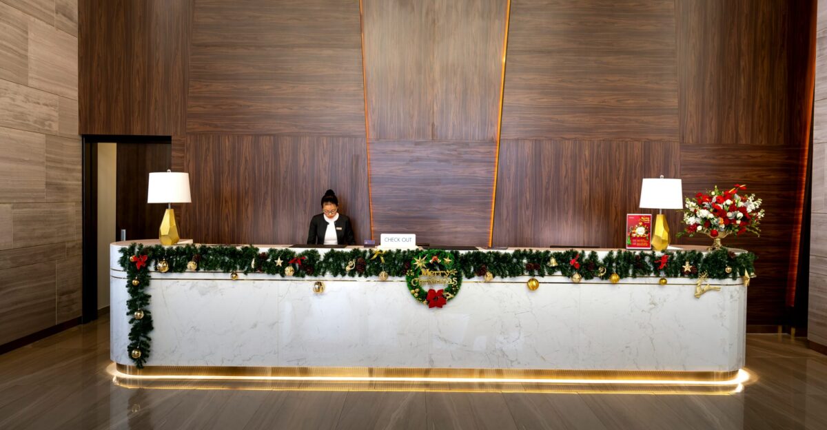 a woman sitting at a desk with a laptop