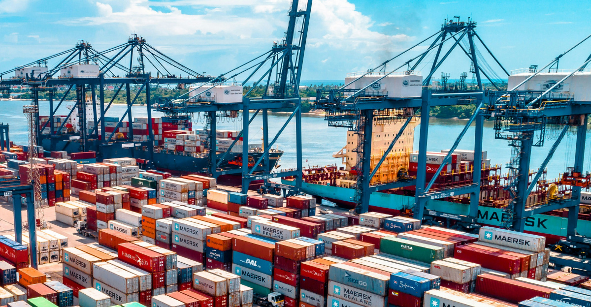 a large amount of containers are stacked on top of each other