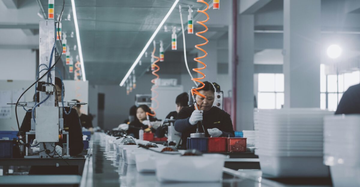 a group of people working in a factory