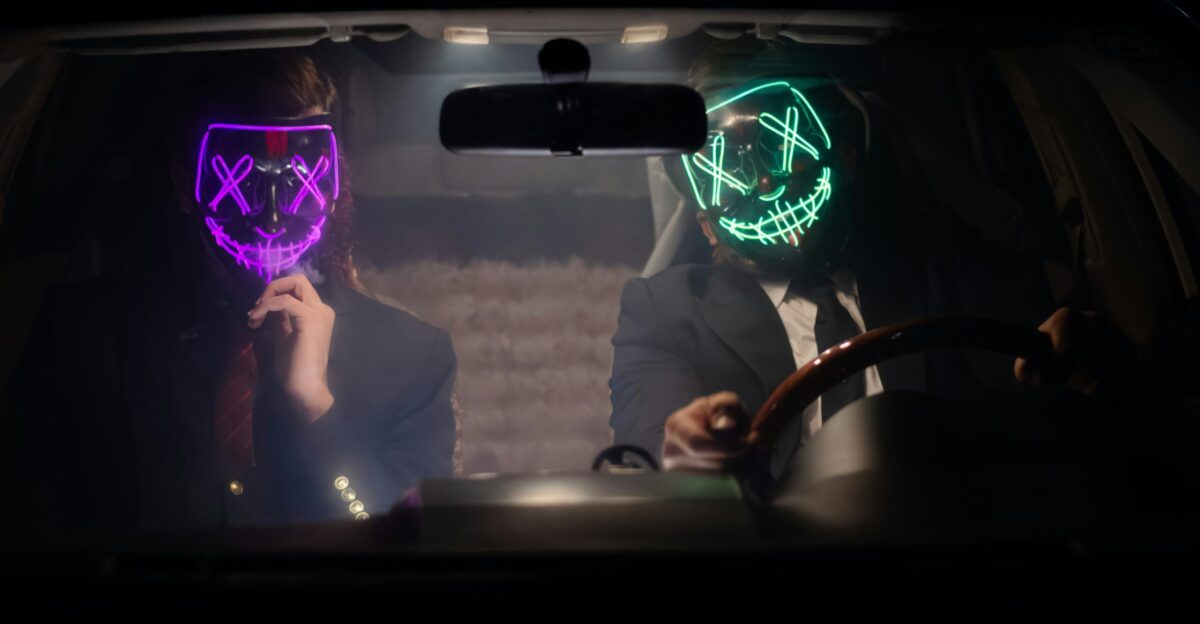 a couple of people that are sitting in a car