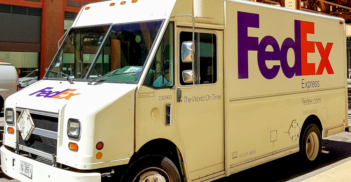 A fedex truck parked on the side of the road