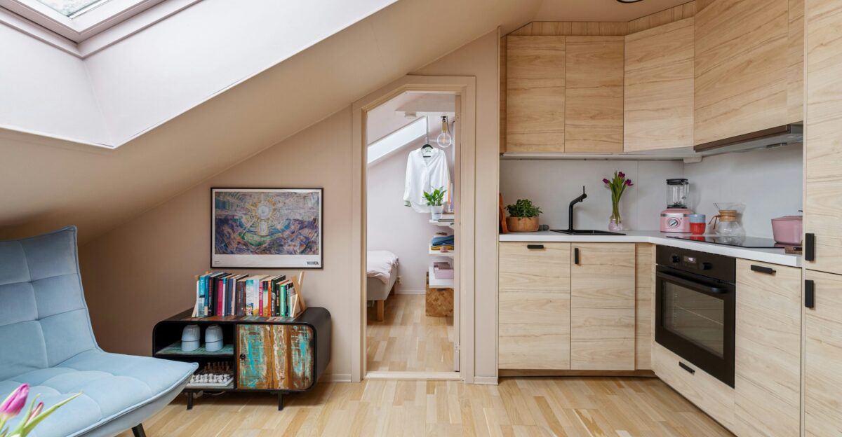 A kitchen and living room with a skylight