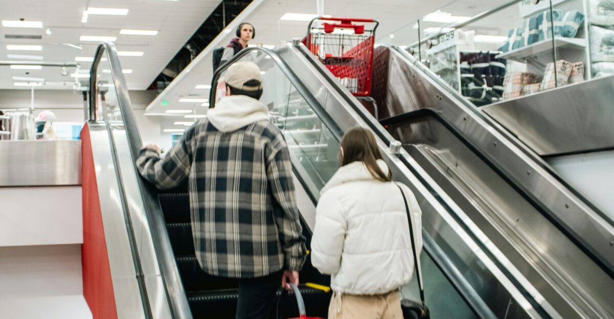 People ride the escalator in a retail store