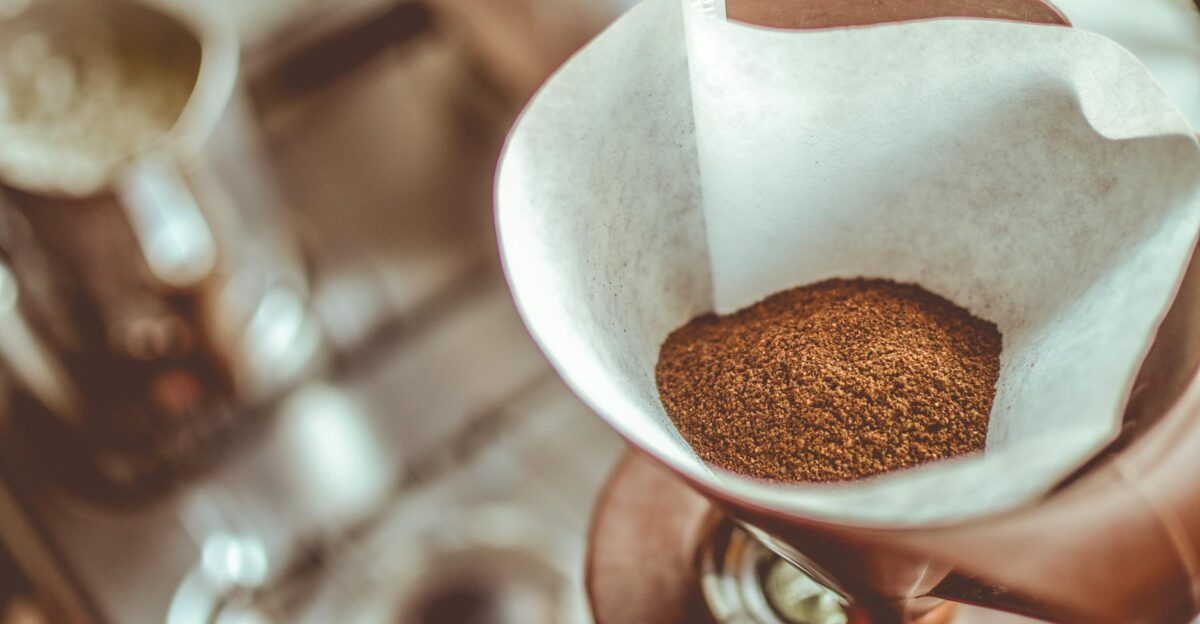 A close-up of ground coffee in a pour-over filter on a stovetop background ideal for coffee enthusiasts
