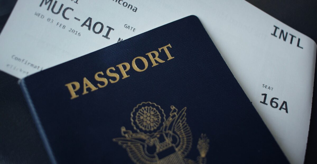 passport booklet on top of white paper